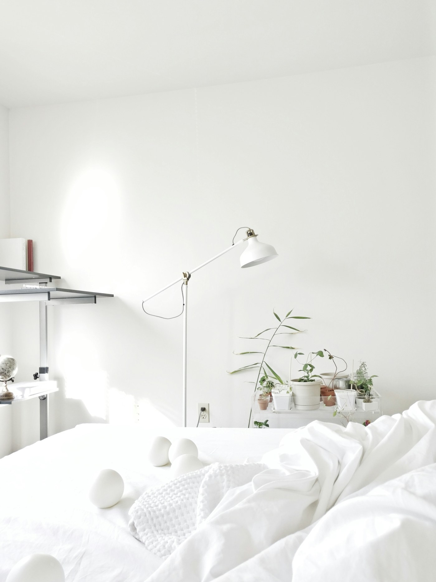 Dome floor lamp beside an armchair