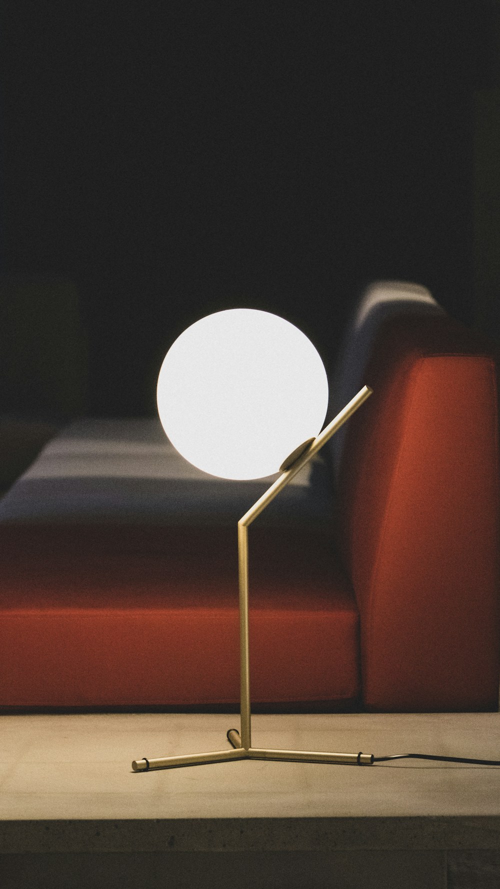 Opal table lamp on a side table in a living room